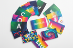 An array of colorful business cards on a white background