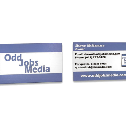 [photo] Two blue and white business cards for 'Odd Jobs Media' shown on a pure white background.