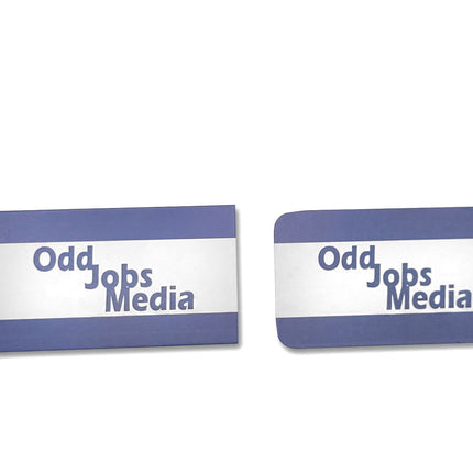 [photo] Two rectangular business cards, one with rounded corners featuring the text 'Odd Jobs Media' in blue on a pure white background.