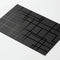 Black business card with geometric spot UV gloss design on white background