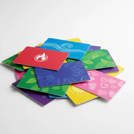 Colorful custom print gift cards with various icons piled on a white background
