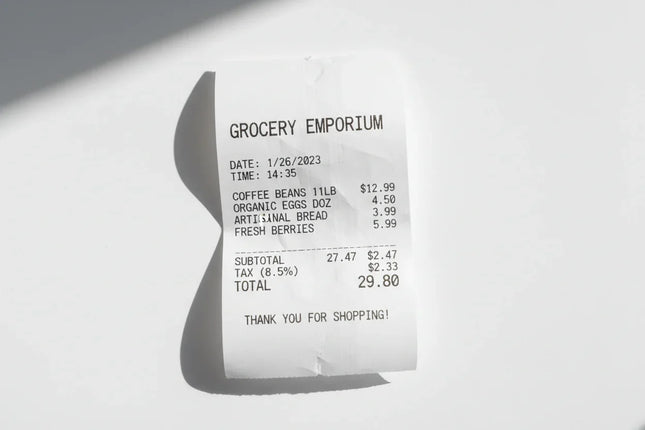 Thermal paper receipt with printed itemized grocery list on a white background