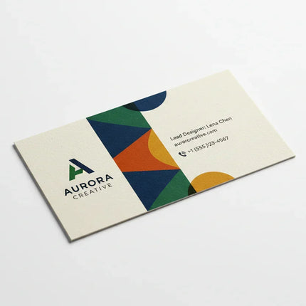 Color printed business card on uncoated stock with geometric design on white background