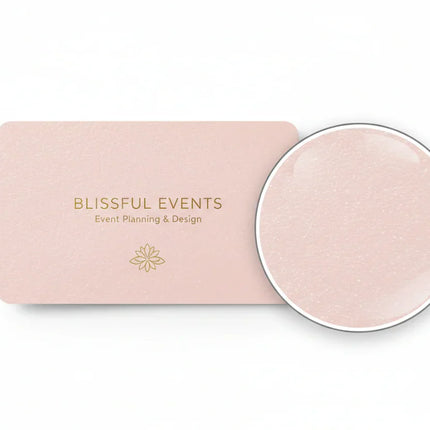Single pink rectangular business card on pearl stock, with circle detail magnifying paper texture