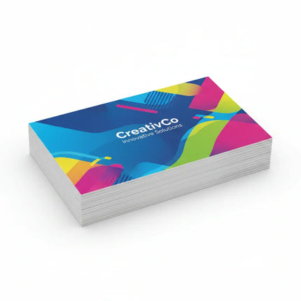 Stack of rectangular color-printed business cards with soft touch lamination on white background