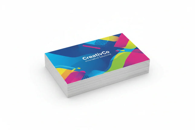 Stack of rectangular color-printed business cards with soft touch lamination on white background