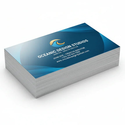 Stack of thick color printed business cards with glossy UV coating on white background