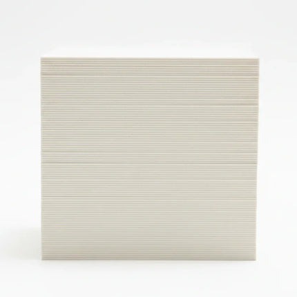 Stack of thick 19-point business cards viewed from the side on a white background