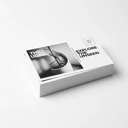 Stack of 4x6 black and white printed postcards on white background