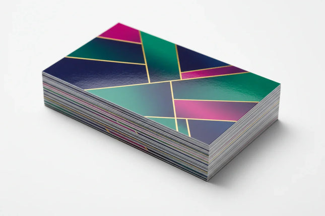 Stack of colorful business cards with UV coating and geometric design on white background