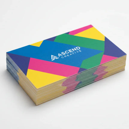 Stack of colorful matte business cards on a white background, custom printed design