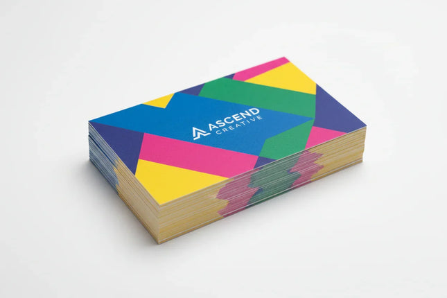 Stack of colorful matte business cards on a white background, custom printed design