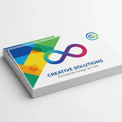 Stack of rectangular business card stickers with vibrant color printing on white background