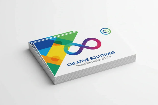 Stack of rectangular business card stickers with vibrant color printing on white background