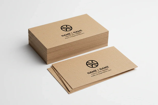 Stack of kraft business cards with black print on white background
