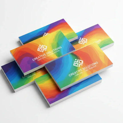 Stack of colorful, rectangular business cards with ultra-smooth finish on a white background