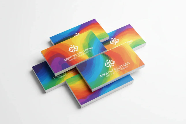Stack of colorful, rectangular business cards with ultra-smooth finish on a white background