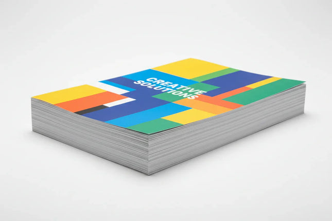 Stack of single-page color flyers with modern geometric design on white background