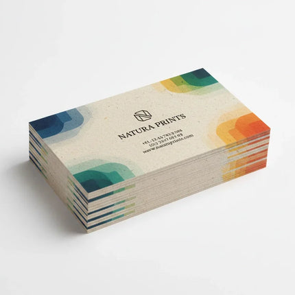 Stack of color-printed business cards on natural card stock with modern geometric design