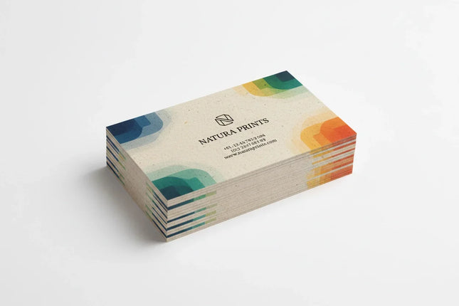 Stack of color-printed business cards on natural card stock with modern geometric design