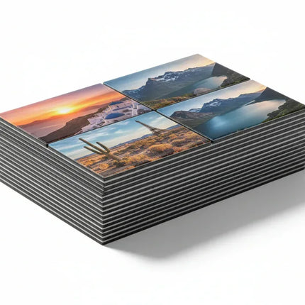 Stack of custom magnet prints featuring scenic landscapes and travel destinations, perfect for home decor or gifts.