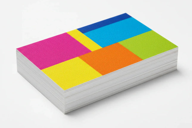 Stack of colorful rectangular business cards on 13pt linen stock, white background