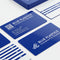 Blue PVC business cards with white printing displayed on a white background