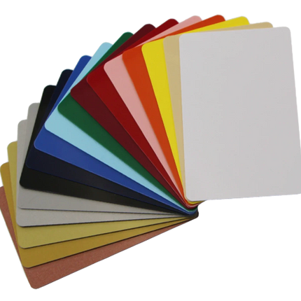 Assorted blank plastic ID cards in various colors fanned out on a white background.
