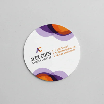 Color printed circular business card with purple and orange graphic accents on white background