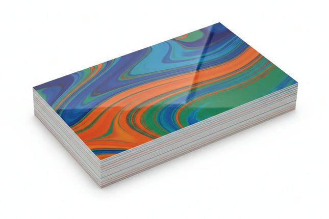 Stack of 18pt thick glossy business cards with colorful abstract design on white background