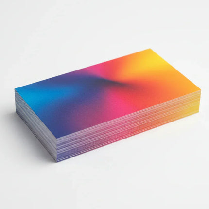 Stack of rectangular matte laminated business cards with colorful gradient design on white background