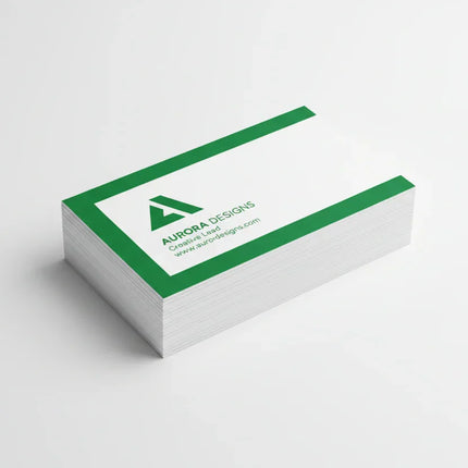 Stack of rectangular business cards with green and white print on a white background