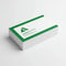Stack of rectangular business cards with green and white print on a white background