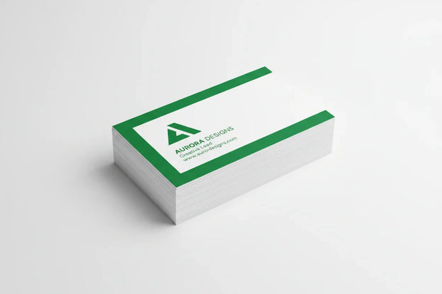 Stack of rectangular business cards with green and white print on a white background