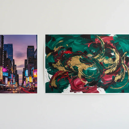 [AI] Two color posters, one small cityscape and one larger abstract art, on a white wall.