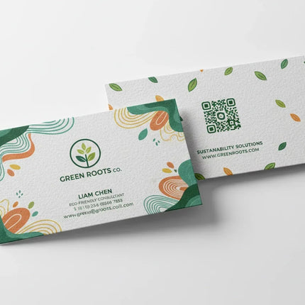 Two white hemp blend business cards with colorful prints, eco-friendly design, and QR code.